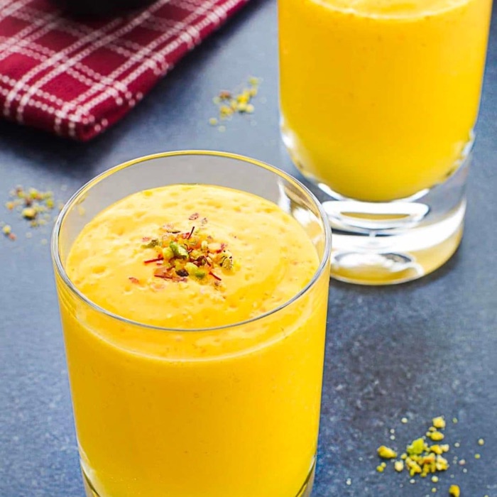 Mango lassi topped with pistachio and saffron